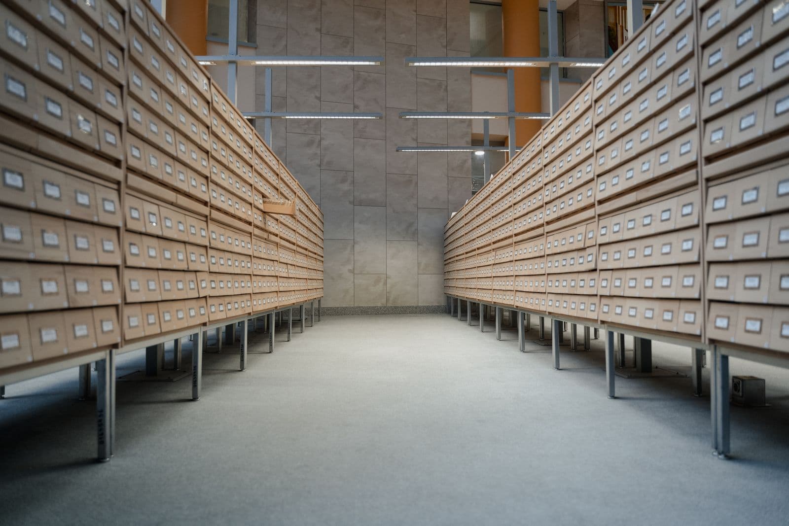 Rows of wooden card-catalogue drawers in an archive